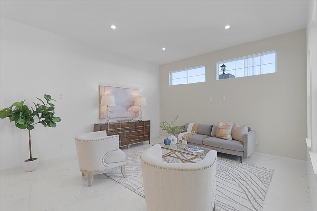 2933 El Fenice Ln, Houston, TX 77057 - living room with light marble finish flooring, recessed lighting, and baseboards