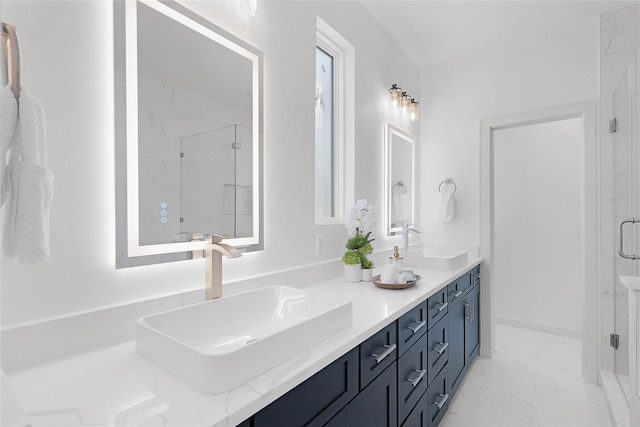 2933 El Fenice Ln, Houston, TX 77057 - bathroom featuring marble look tiles, a marble finish shower, double vanity, and baseboards