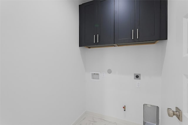 2933 El Fenice Ln, Houston, TX 77057 - washroom featuring gas dryer hookup, hookup for an electric dryer, marble finish floors, and cabinet space