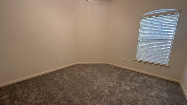 10208 Forest Spring Ln, Pearland, TX 77584 - unfurnished room with dark carpet and baseboards