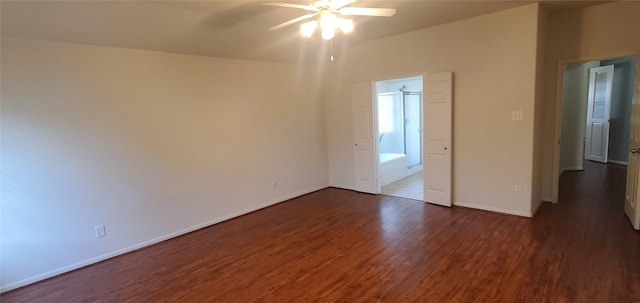 10208 Forest Spring Ln, Pearland, TX 77584 - unfurnished bedroom featuring dark wood-type flooring, baseboards, and a ceiling fan