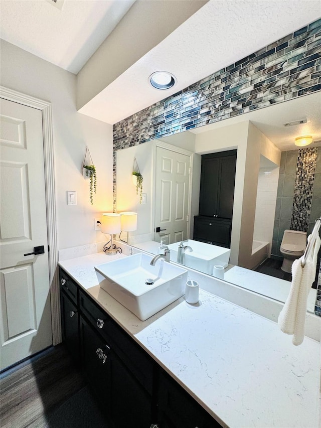 7210 Blenheim Palace Ln, Houston, TX 77095 - bathroom with vanity, tiled shower, and toilet
