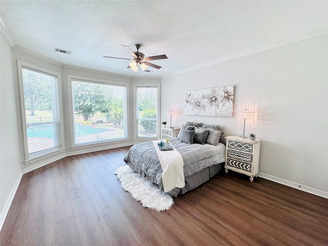 7210 Blenheim Palace Ln, Houston, TX 77095 - bedroom featuring ornamental molding, a textured ceiling, dark wood finished floors, baseboards, and ceiling fan