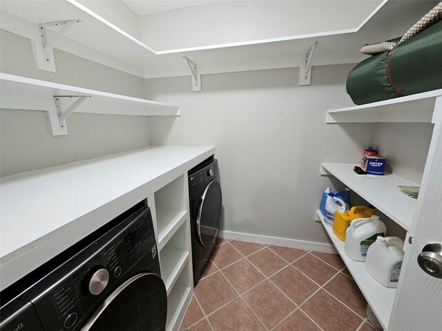15358 Mcconn St, Houston, TX 77598 - laundry room featuring baseboards, washer and dryer, and dark tile patterned floors