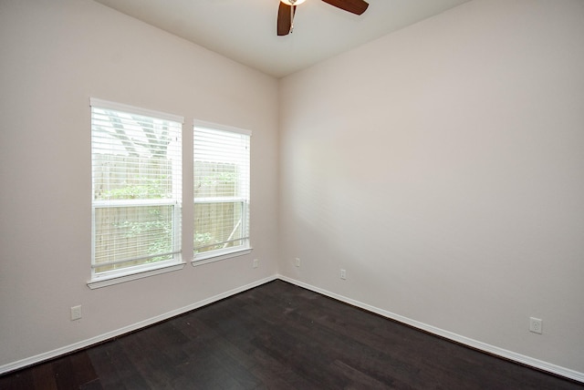2213 Bellefontaine St, Houston, TX 77030 - spare room featuring dark wood finished floors, ceiling fan, and baseboards