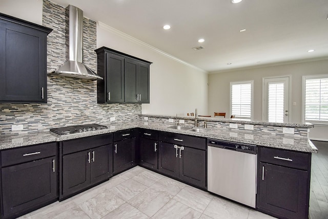 2213 Bellefontaine St, Houston, TX 77030 - kitchen with appliances with stainless steel finishes, wall chimney range hood, a sink, a peninsula, and crown molding