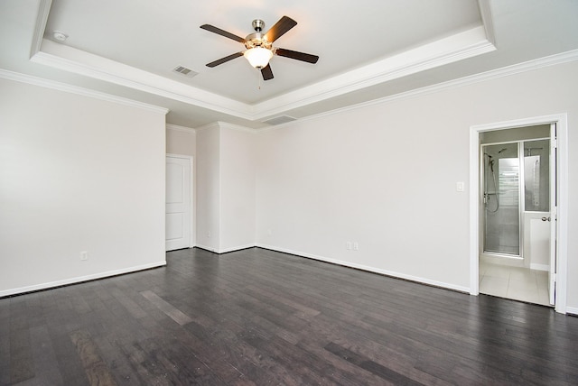 2213 Bellefontaine St, Houston, TX 77030 - spare room with a tray ceiling, ceiling fan, dark wood-style floors, crown molding, and baseboards