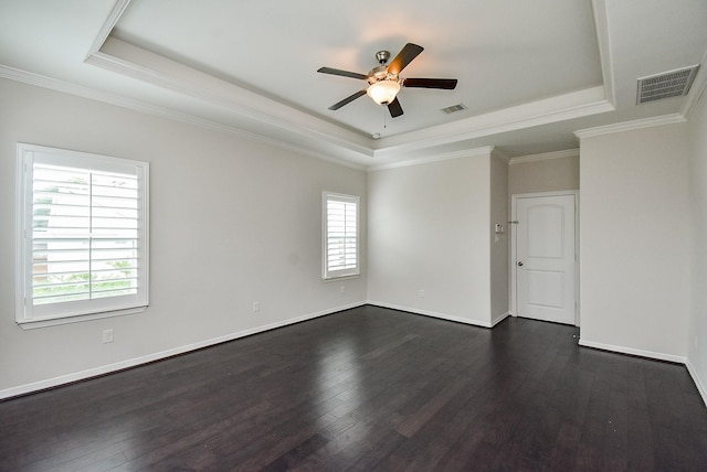 2213 Bellefontaine St, Houston, TX 77030 - empty room with a raised ceiling, healthy amount of natural light, ceiling fan, dark wood-type flooring, and ornamental molding