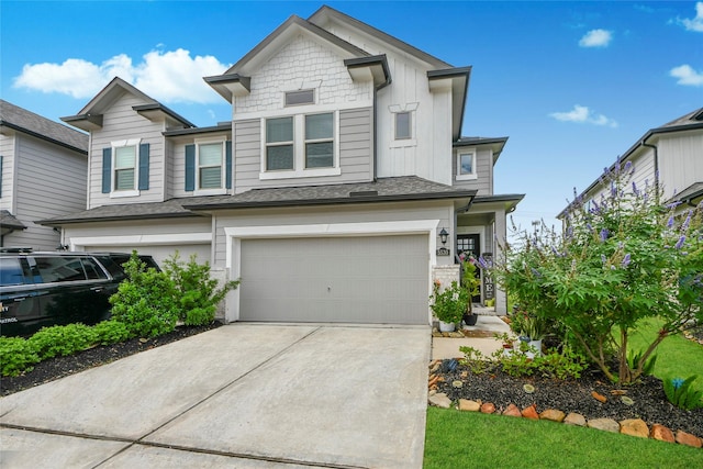5530 Evanston Ln, Pasadena, TX 77505 - view of front of property with a garage, driveway, and board and batten siding