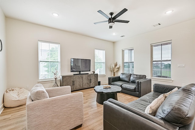 2515 103rd St, Galveston, TX 77554 - living room with light wood-style flooring, plenty of natural light, ceiling fan, recessed lighting, and baseboards