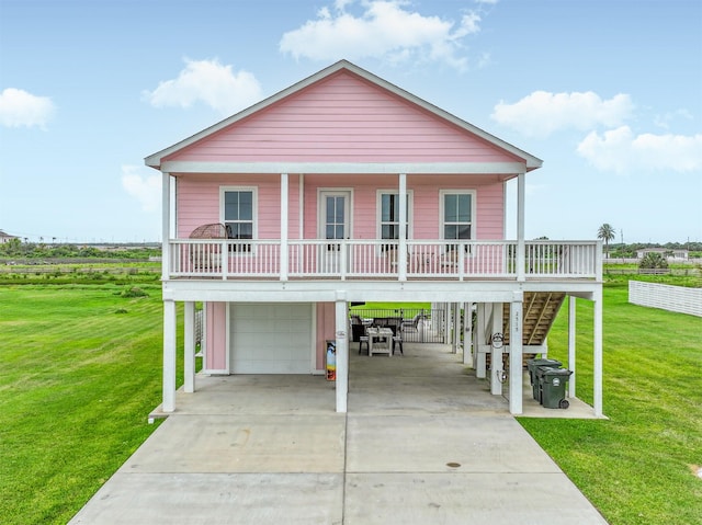 2515 103rd St, Galveston, TX 77554 - coastal home with a carport, driveway, stairs, and an attached garage