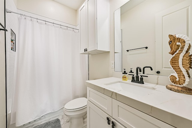 2515 103rd St, Galveston, TX 77554 - bathroom with vanity, toilet, marble look tile flooring, and shower / bath combination with curtain