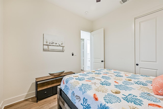 2515 103rd St, Galveston, TX 77554 - bedroom featuring light wood-style flooring, baseboards, and a ceiling fan