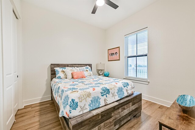 2515 103rd St, Galveston, TX 77554 - bedroom featuring light wood-style floors, baseboards, ceiling fan, and a closet