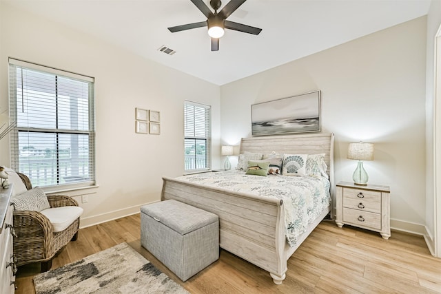 2515 103rd St, Galveston, TX 77554 - bedroom featuring light wood-style floors, baseboards, and ceiling fan
