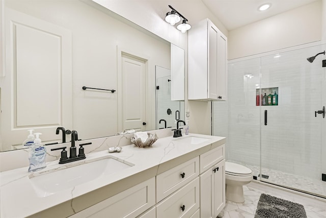 2515 103rd St, Galveston, TX 77554 - bathroom with marble finish floors, toilet, double vanity, a shower stall, and recessed lighting
