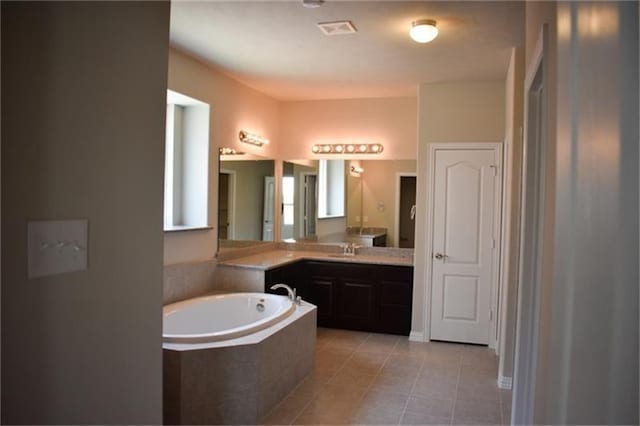 811 River Delta Ln, Rosenberg, TX 77469 - full bath with a garden tub, vanity, and tile patterned floors