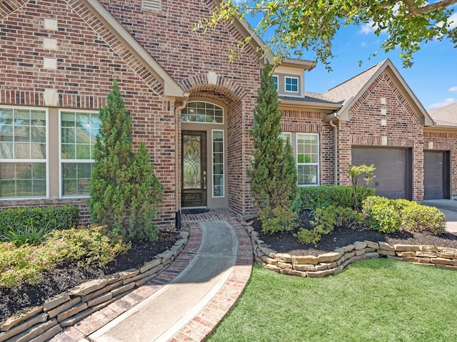 16819 Himley Dr, Cypress, TX 77433 - doorway to property with brick siding, a garage, driveway, and a lawn