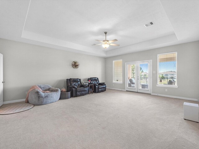 16819 Himley Dr, Cypress, TX 77433 - sitting room featuring a tray ceiling, carpet floors, and baseboards
