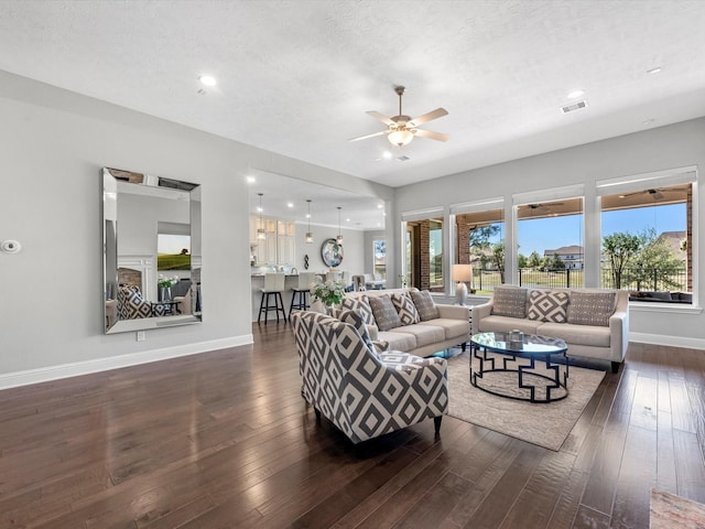 16819 Himley Dr, Cypress, TX 77433 - living area featuring baseboards, a ceiling fan, dark wood-style floors, a textured ceiling, and recessed lighting