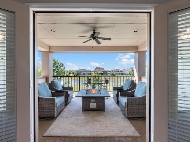 16819 Himley Dr, Cypress, TX 77433 - view of patio with ceiling fan, a water view, and an outdoor living space with a fire pit