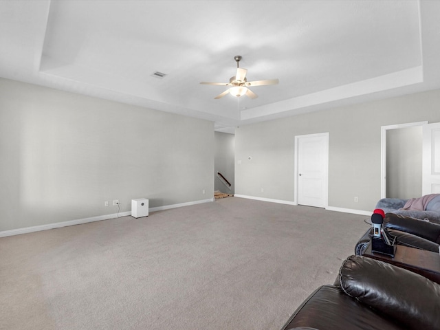 16819 Himley Dr, Cypress, TX 77433 - carpeted living area with a raised ceiling, ceiling fan, and baseboards