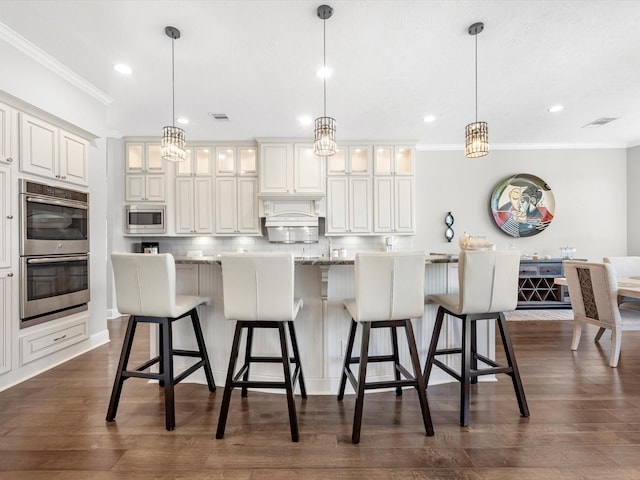 16819 Himley Dr, Cypress, TX 77433 - kitchen featuring stainless steel appliances, ornamental molding, recessed lighting, decorative backsplash, and dark wood-style flooring