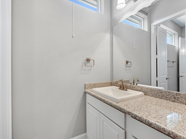 16819 Himley Dr, Cypress, TX 77433 - bathroom featuring vanity and plenty of natural light