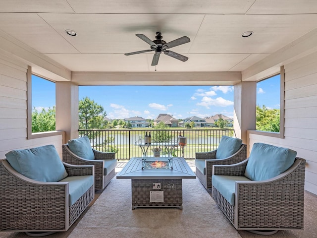 16819 Himley Dr, Cypress, TX 77433 - view of patio with a ceiling fan, a water view, and an outdoor living space with a fire pit
