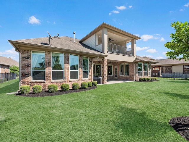 16819 Himley Dr, Cypress, TX 77433 - rear view of house featuring a balcony, ceiling fan, brick siding, and a patio