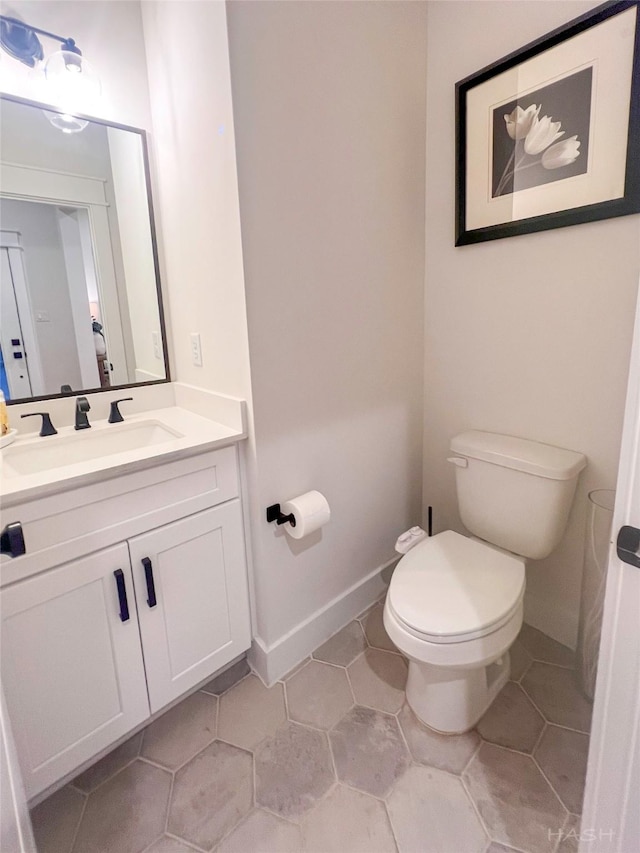 5402 Wheatley St Unit D, Houston, TX 77091 - bathroom featuring toilet, vanity, tile patterned floors, and baseboards