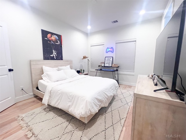 5402 Wheatley St Unit D, Houston, TX 77091 - bedroom with light wood-style floors, baseboards, and recessed lighting