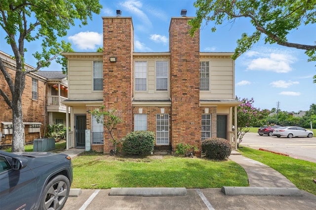 2626 Holly Hall St Unit 1102, Houston, TX 77054 - multi unit property with uncovered parking, a chimney, and a front yard