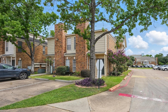 2626 Holly Hall St Unit 1102, Houston, TX 77054 - view of front of house featuring brick siding and uncovered parking