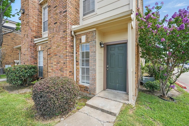 2626 Holly Hall St Unit 1102, Houston, TX 77054 - doorway to property featuring brick siding