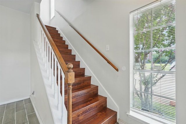 2626 Holly Hall St Unit 1102, Houston, TX 77054 - staircase featuring baseboards