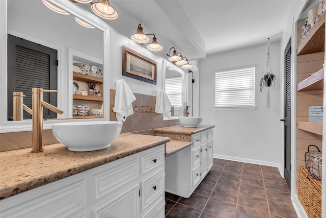 16310 Sir William Dr, Spring, TX 77379 - bathroom with vanity, decorative backsplash, tile patterned flooring, and baseboards
