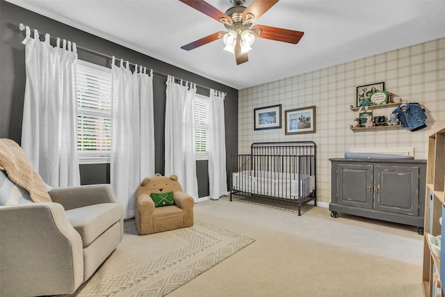16310 Sir William Dr, Spring, TX 77379 - bedroom with wallpapered walls, light carpet, baseboards, a nursery area, and a ceiling fan