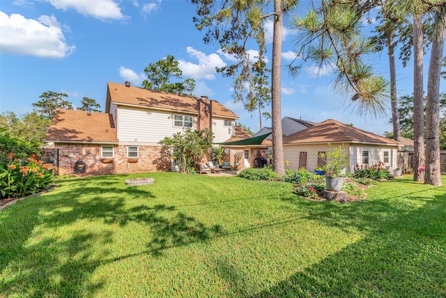 16310 Sir William Dr, Spring, TX 77379 - view of grassy yard featuring a patio area