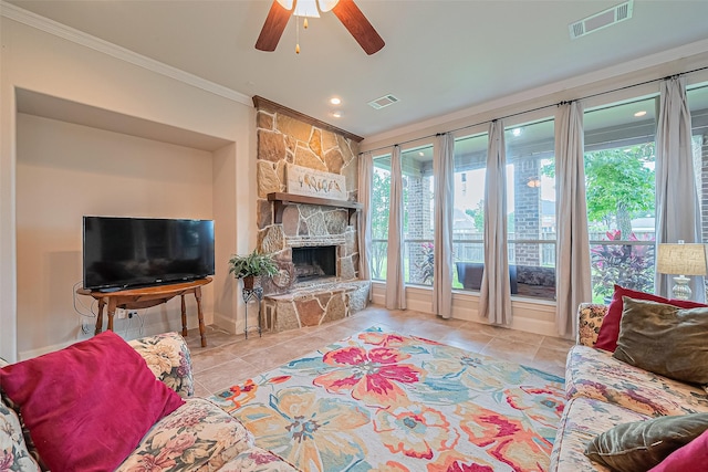 11907 Wind Cove Place Ct, Humble, TX 77346 - tiled living area with crown molding, a ceiling fan, a fireplace, recessed lighting, and baseboards