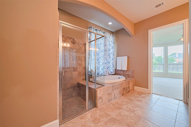 11907 Wind Cove Place Ct, Humble, TX 77346 - full bathroom with a bath, a stall shower, baseboards, and tile patterned flooring