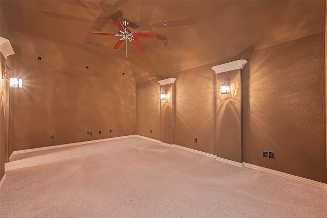 11907 Wind Cove Place Ct, Humble, TX 77346 - spare room featuring carpet floors, a ceiling fan, vaulted ceiling, and baseboards