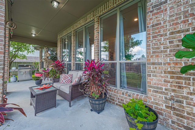 11907 Wind Cove Place Ct, Humble, TX 77346 - porch with area for grilling and an outdoor hangout area