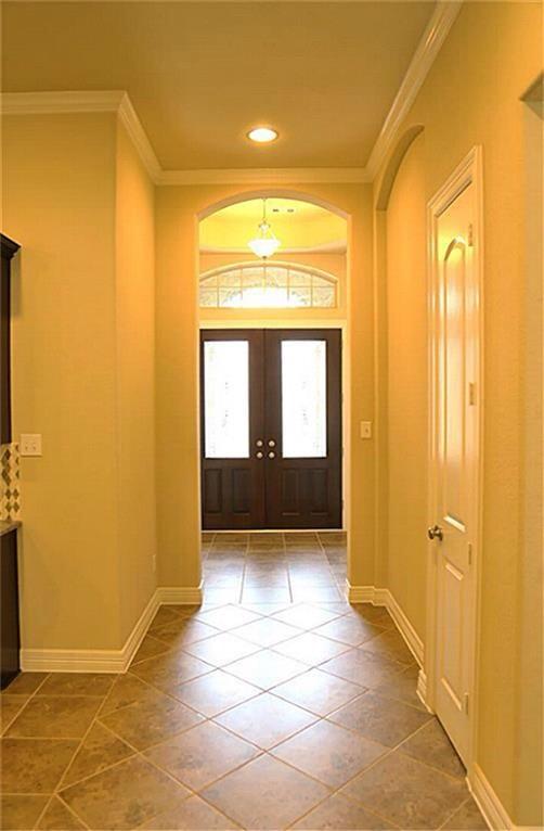 4914 Ava Meadows Ln, Sugar Land, TX 77479 - entrance foyer with ornamental molding, french doors, baseboards, tile patterned flooring, and recessed lighting