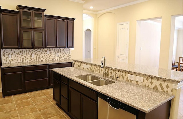 4914 Ava Meadows Ln, Sugar Land, TX 77479 - kitchen with dishwasher, a sink, crown molding, tasteful backsplash, and arched walkways