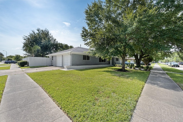 2701 Oaks Dr, Pasadena, TX 77502 - view of front of house featuring driveway, a garage, and brick siding