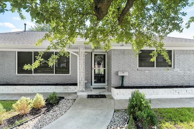 2701 Oaks Dr, Pasadena, TX 77502 - view of front of house with brick siding, a porch, and a shingled roof