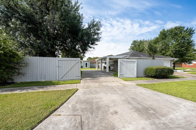 2701 Oaks Dr, Pasadena, TX 77502 - view of concrete surface featuring a gate