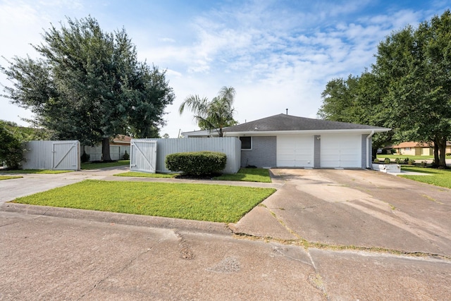 2701 Oaks Dr, Pasadena, TX 77502 - single story home with a gate, concrete driveway, and an attached garage