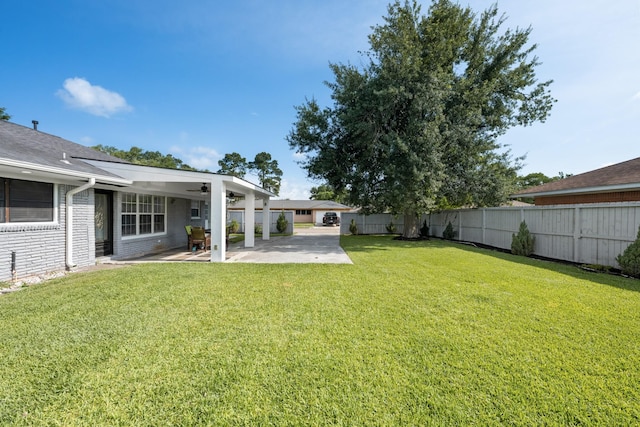 2701 Oaks Dr, Pasadena, TX 77502 - view of yard featuring a patio area and ceiling fan